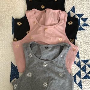 Set of three size small club pilates crop tops.